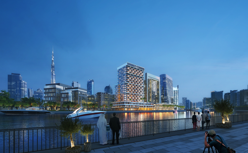 Business Bay canal at night with the Burj Khalifa skyline