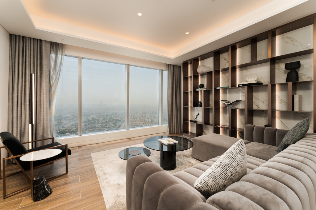 Apartment living room with floor-to-ceiling skyline views